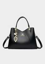 Felina™ - Elegant black shoulder bag with fashionable charms - Eliza-Warszawa